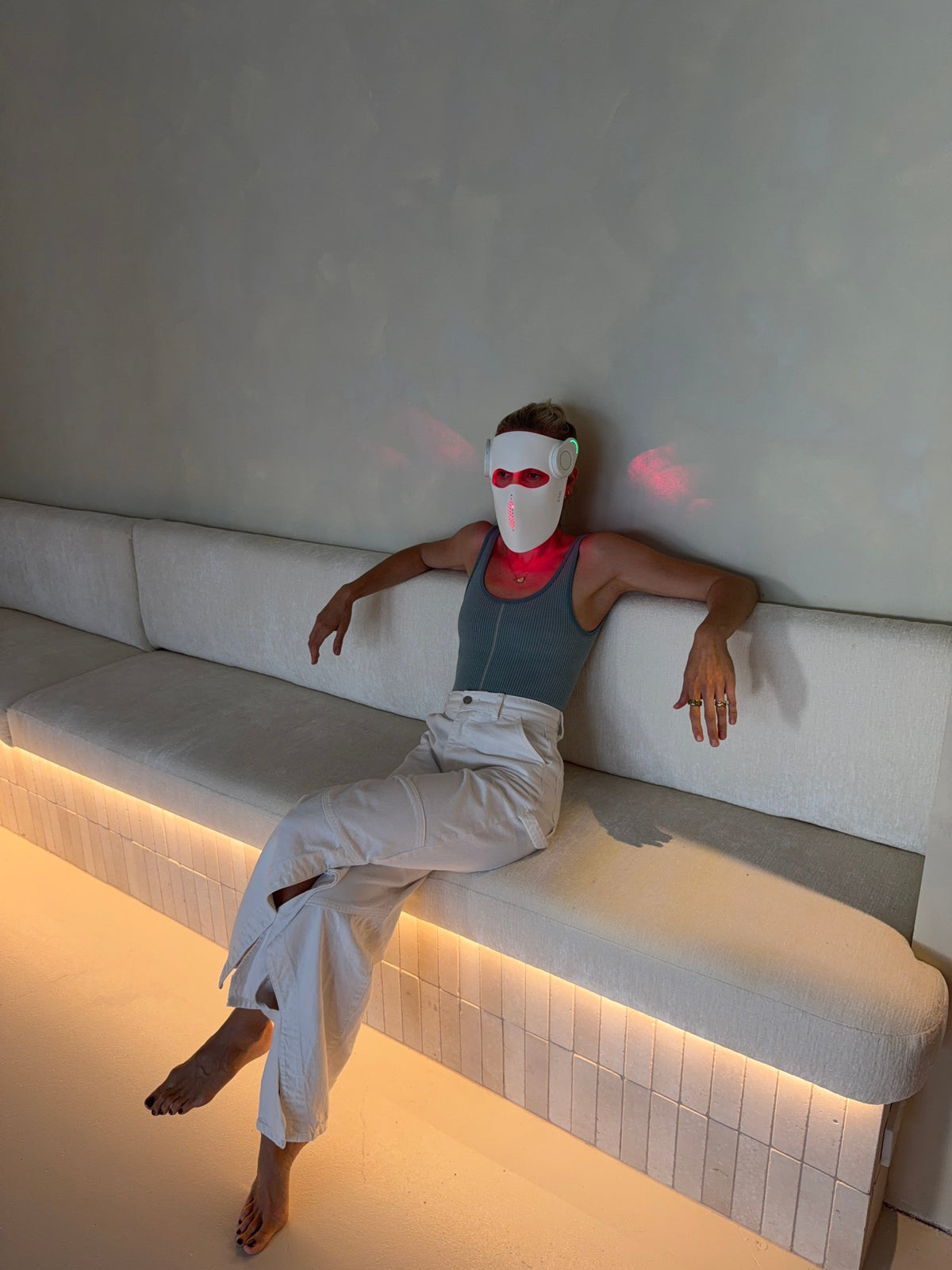 Evening wind down in the LUM8 ProLaser Face Mask on a warm lit lounge