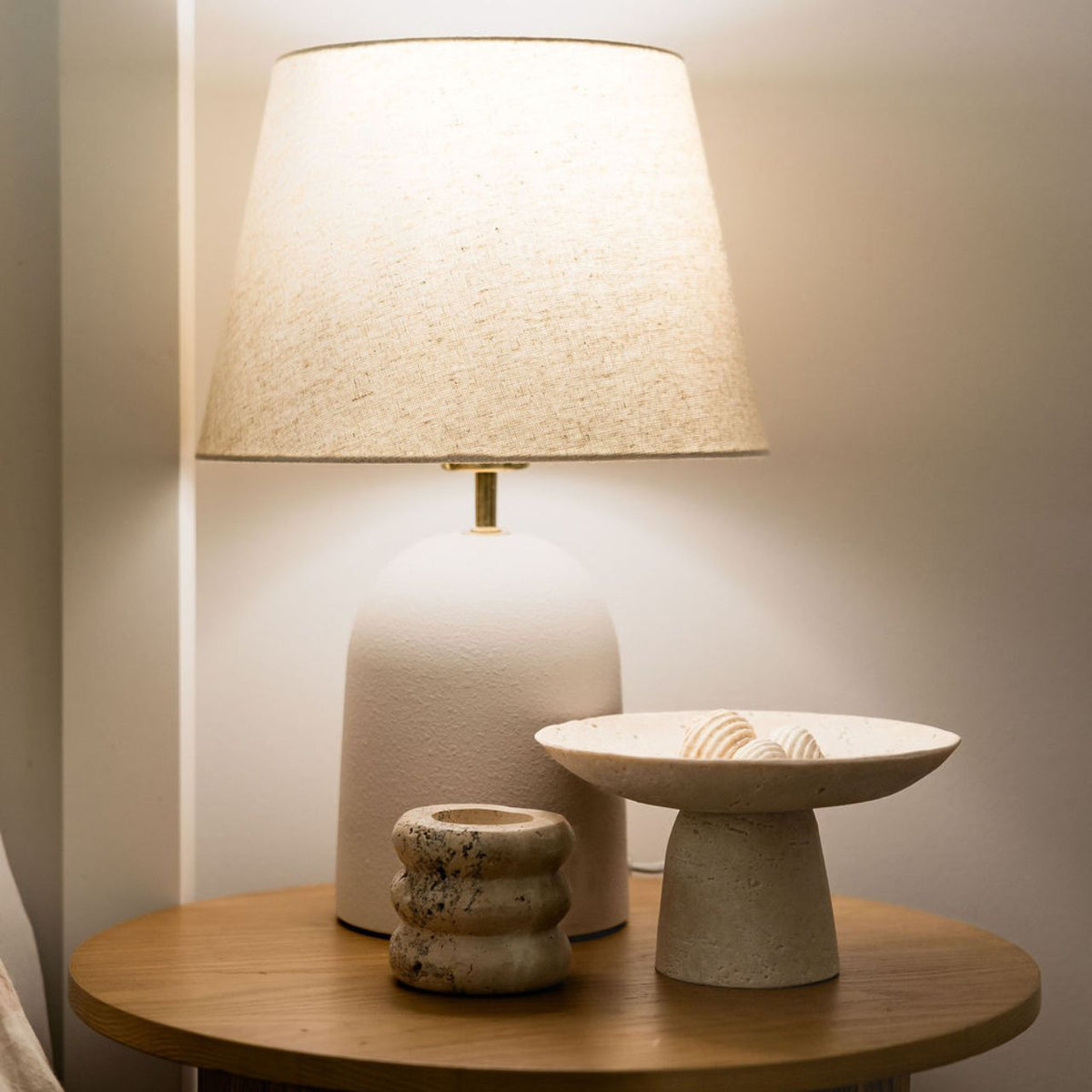 LUM8 Circadian Globe glowing warm amber in bedroom lamp — zero flicker sleep light