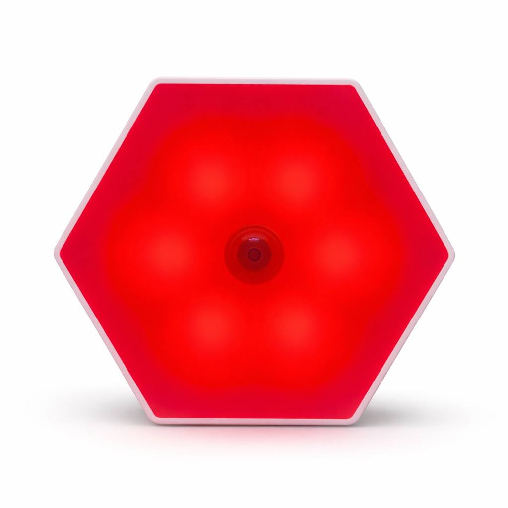 LUM8 Motion Sensor Night Light glowing red in dark hallway — safe sleep-friendly path lighting