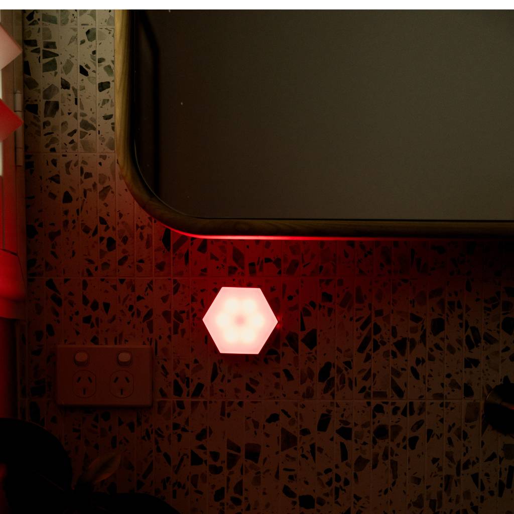 LUM8 Motion Sensor Night Light in use at night — automatic red light activation without disrupting sleep